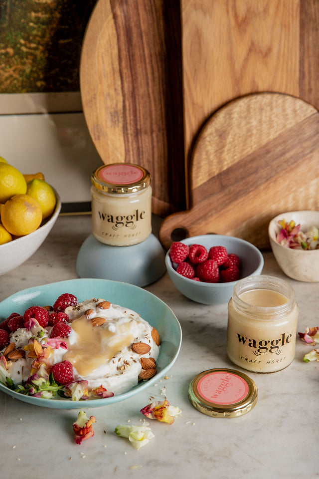 Waggle Breakfast bowl of yoghurt and muesli served with plain creamed honey