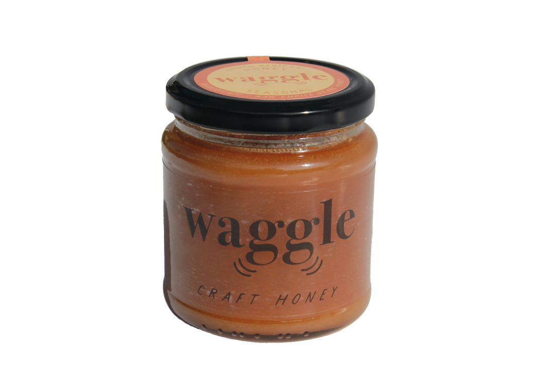 Jar of Waggle’s Seasonal Honey, 340g, featuring a limited-edition small-batch craft honey blend.